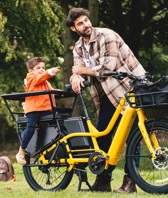 Cycling lifestyle campaign image showing a rider on a yellow bicycle, capturing movement, adventure and authentic brand storytelling