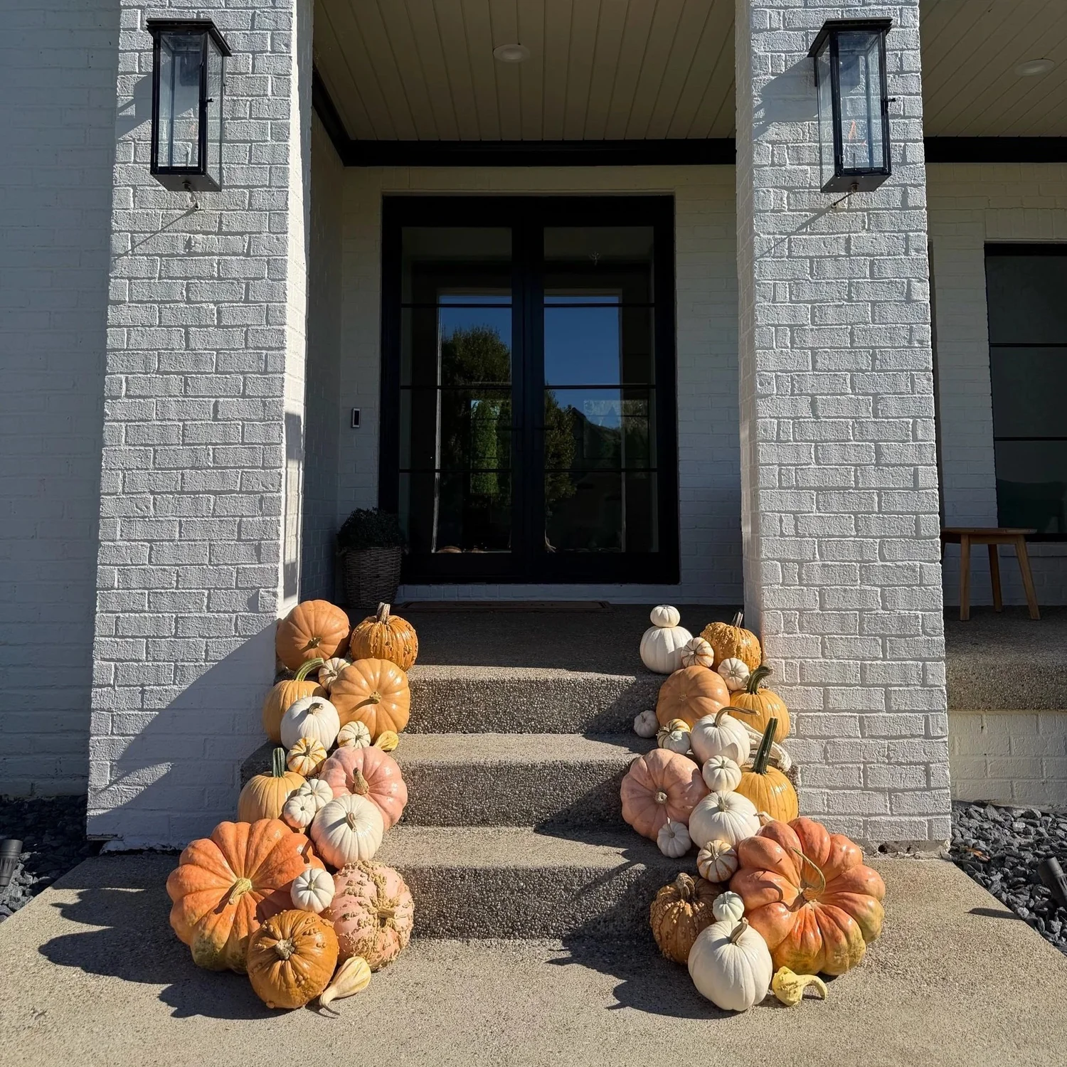 Front porch decorated with pumpkins