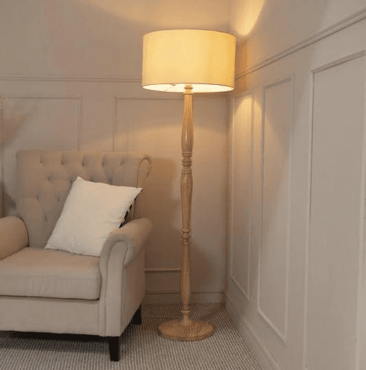 a woman sitting on a couch talking to another woman