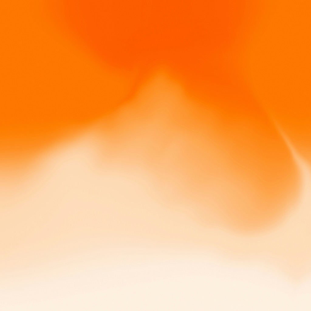 a blurry image of an orange and white background