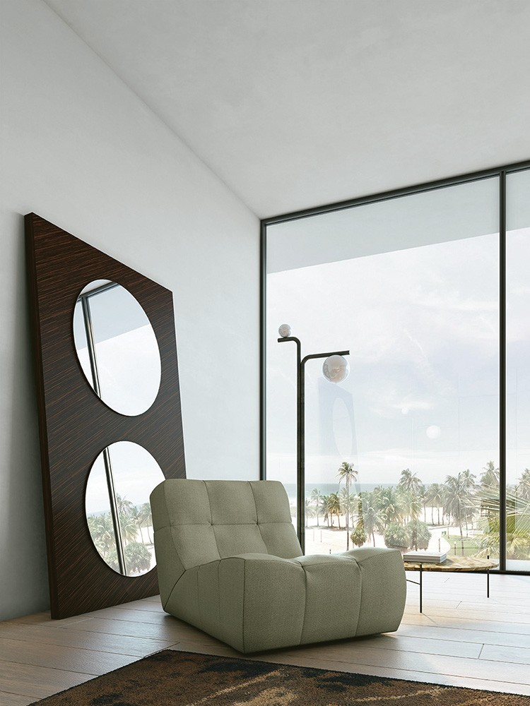 soft armchair and stand up mirror in a villa on the sea