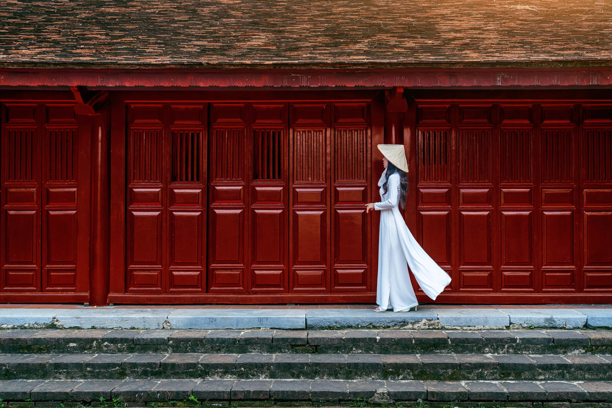 A wooden walkway leading to a body of water