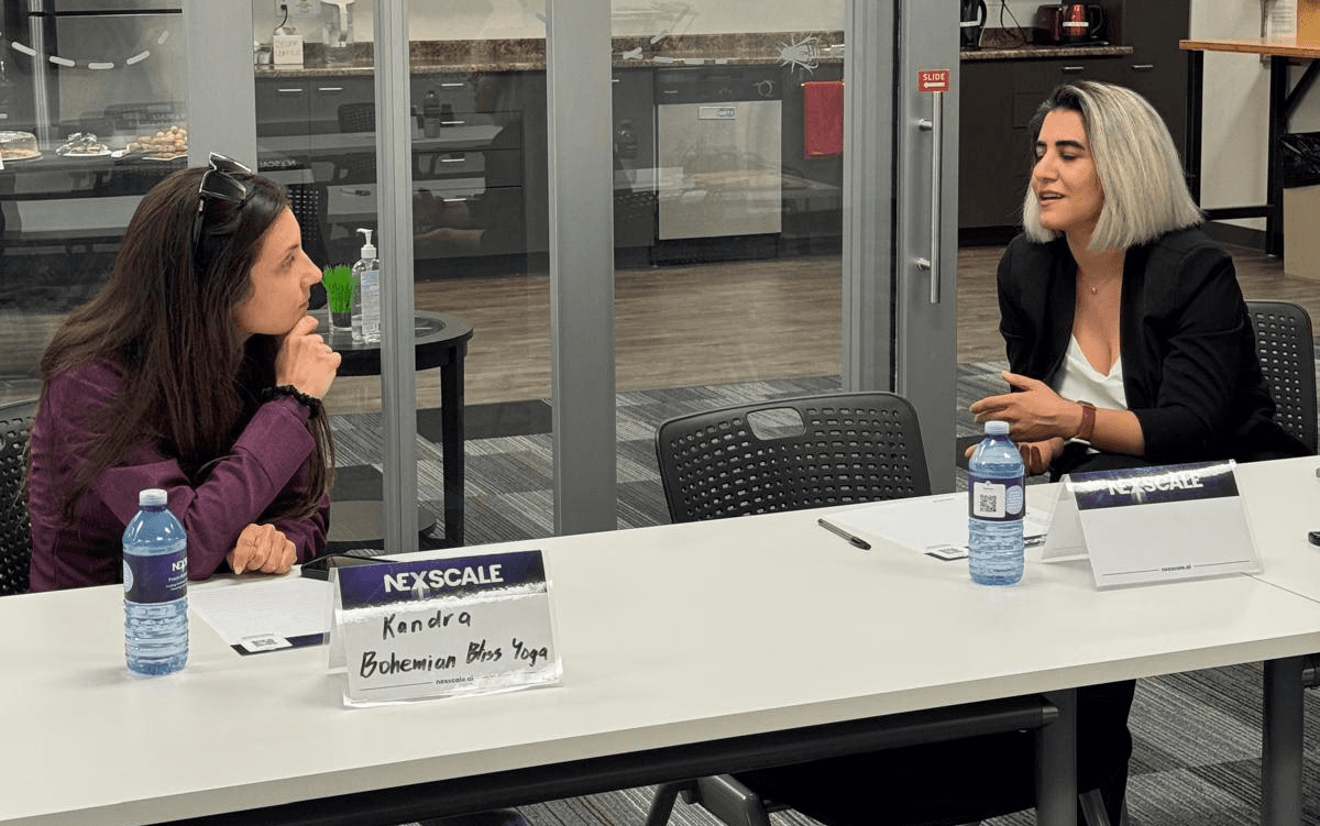This isn't a stage — it's a table. The format is built around real, two-way dialogue.