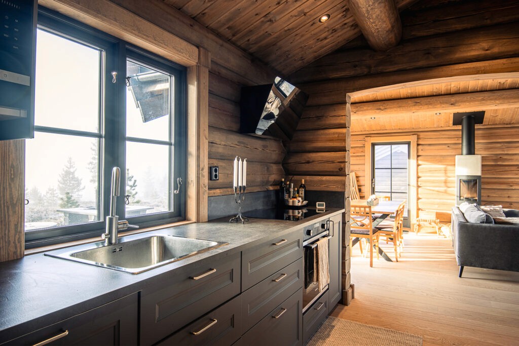 2 sqm log cabin kitchen with rustic cabinets and modern fixtures.