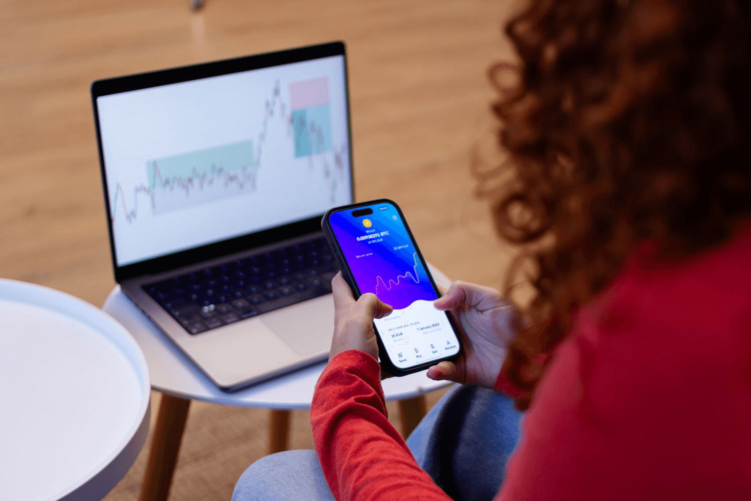 Woman trading crypto on devices - Why Is Polymarket Invite Only