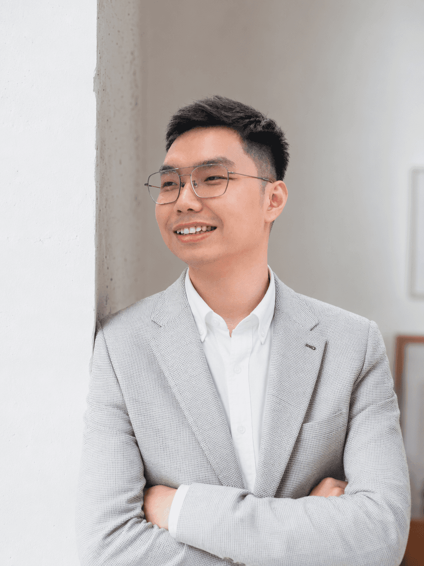 A man sitting on a chair for studio picture