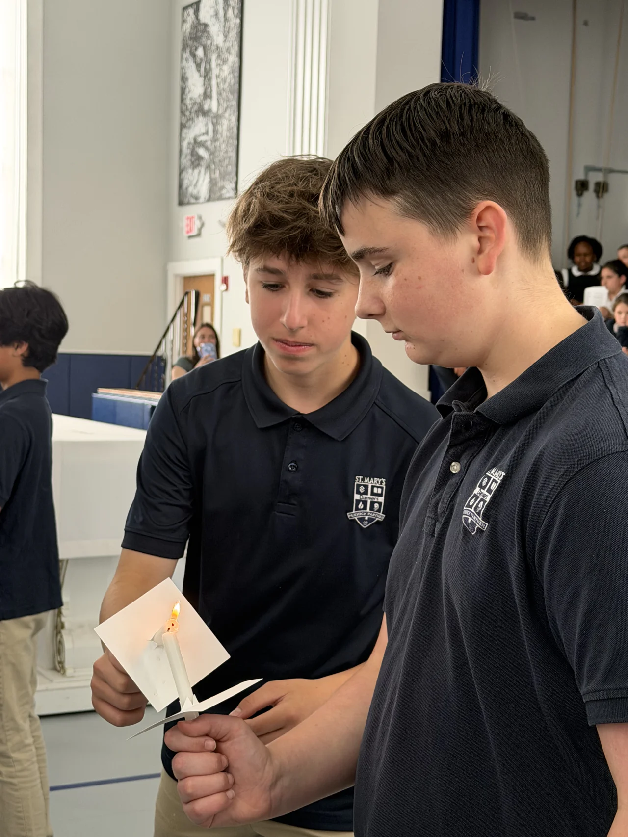 Students gathered in the gym beneath the St. Mary’s school banner