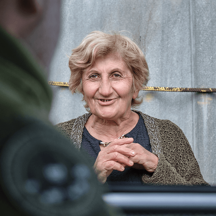 Portrait of a smiling elderly woman helped by the foundation