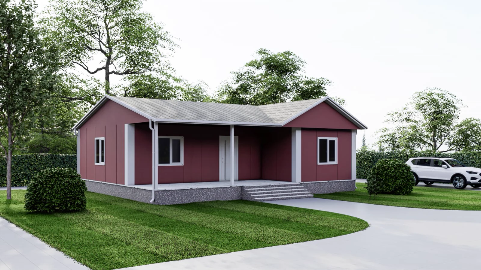 Bungalow prefabbricato rosso a un piano con veranda coperta e giardino circostante.