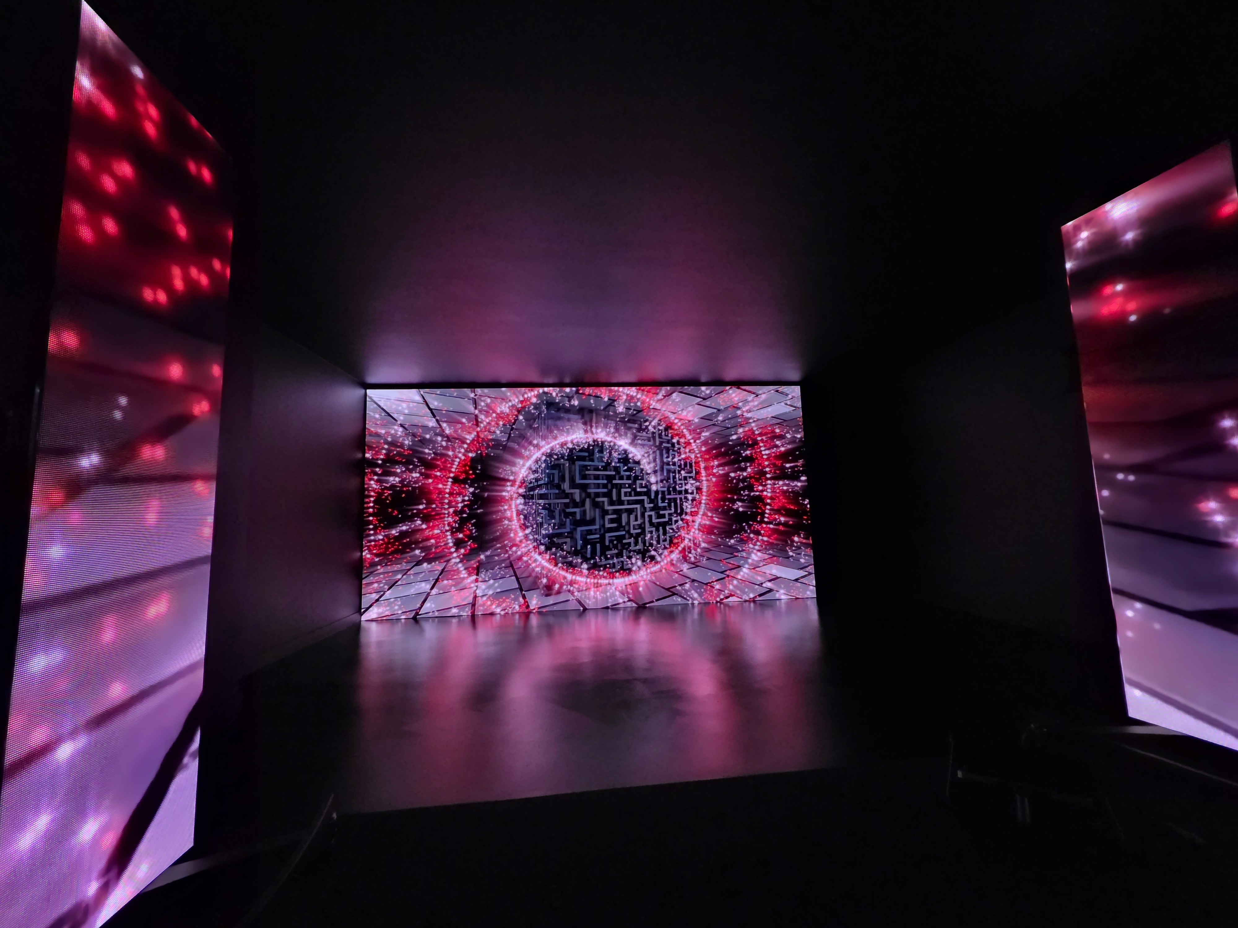 woman in white tube top and blue denim jeans sitting on brown wooden chair