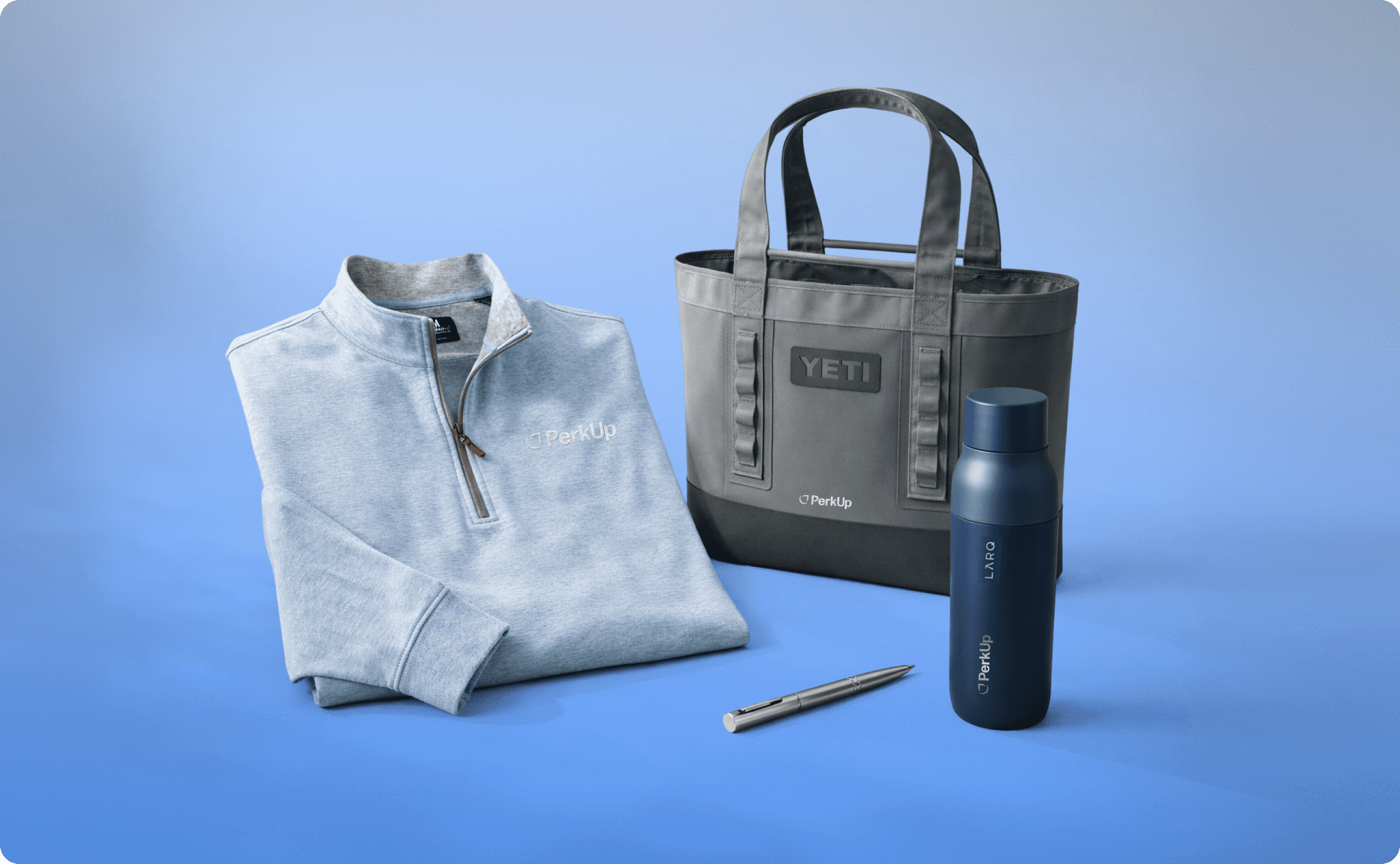 Swag items: polo, a bag, a pen, and an Ocean tumbler.