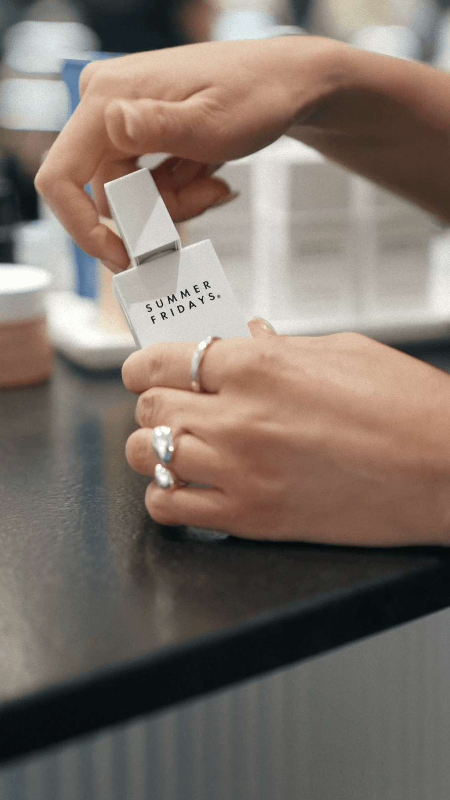 Bride in white dress walking on street, man in background