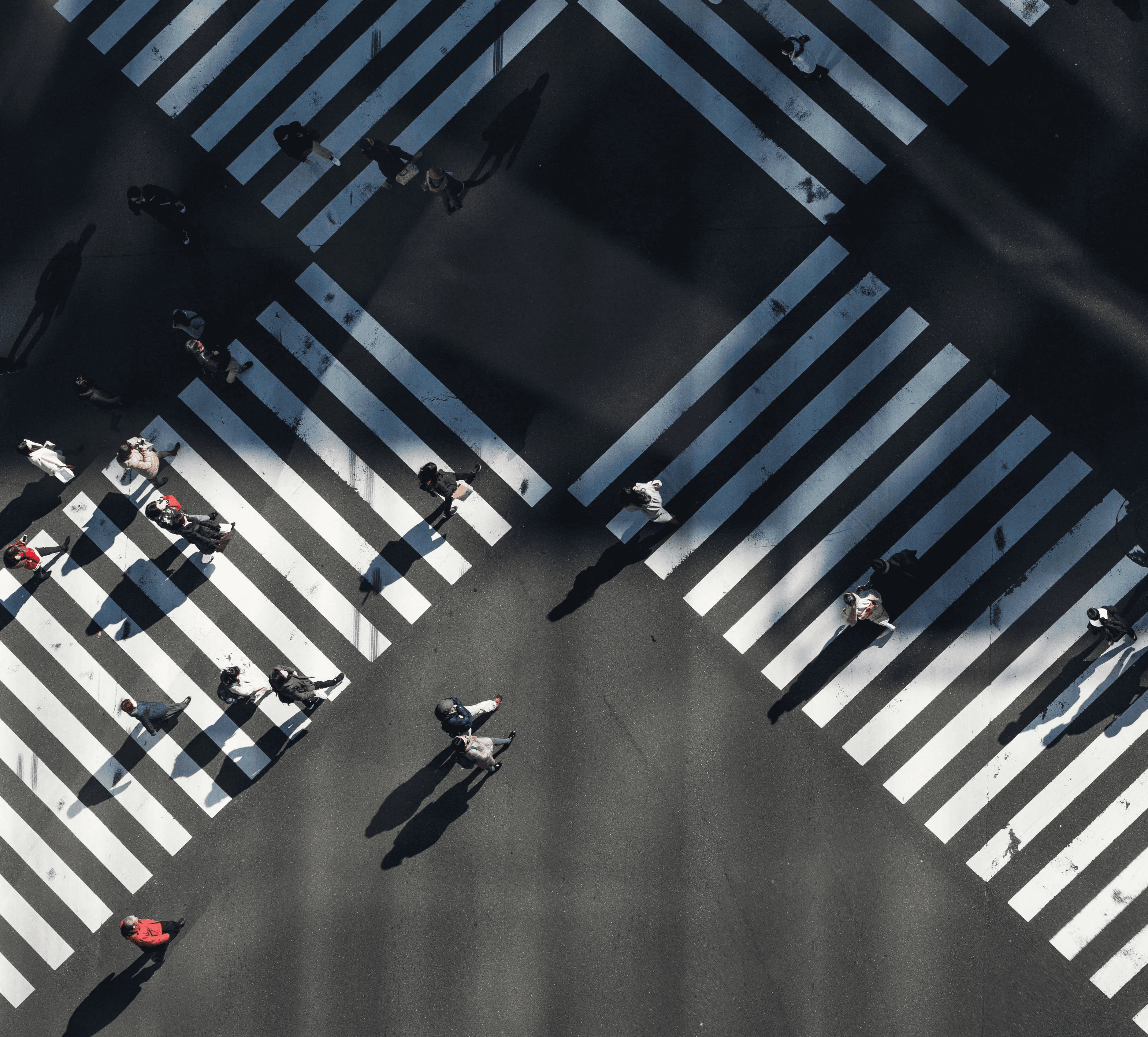Blurred figures of people walking in a busy station.