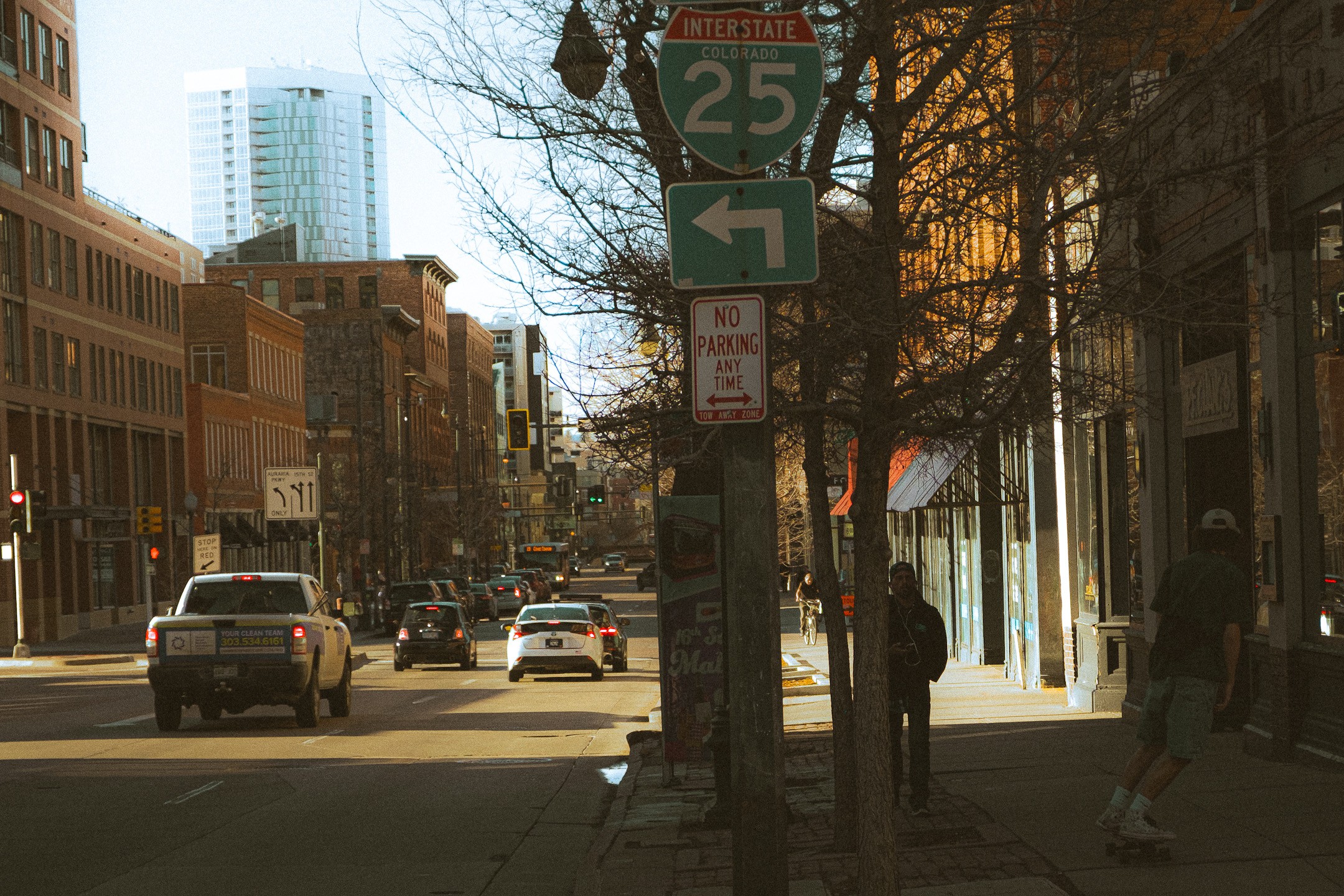  Collaborative work session overhead view of six people collaborating at a rustic wooden table with coffee, papers, and a laptop