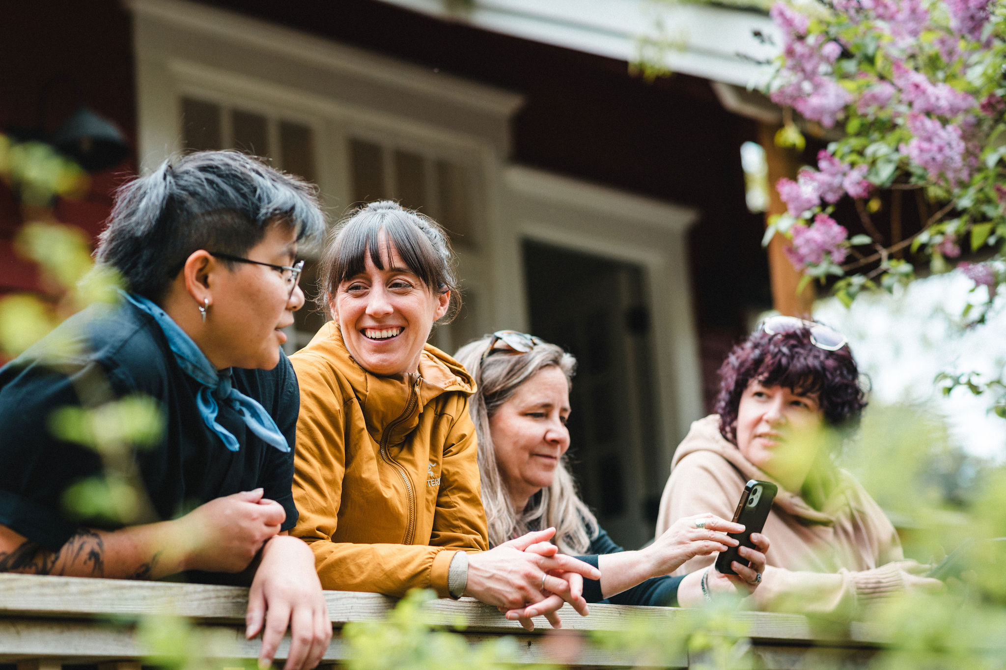 People laughing together on a porch