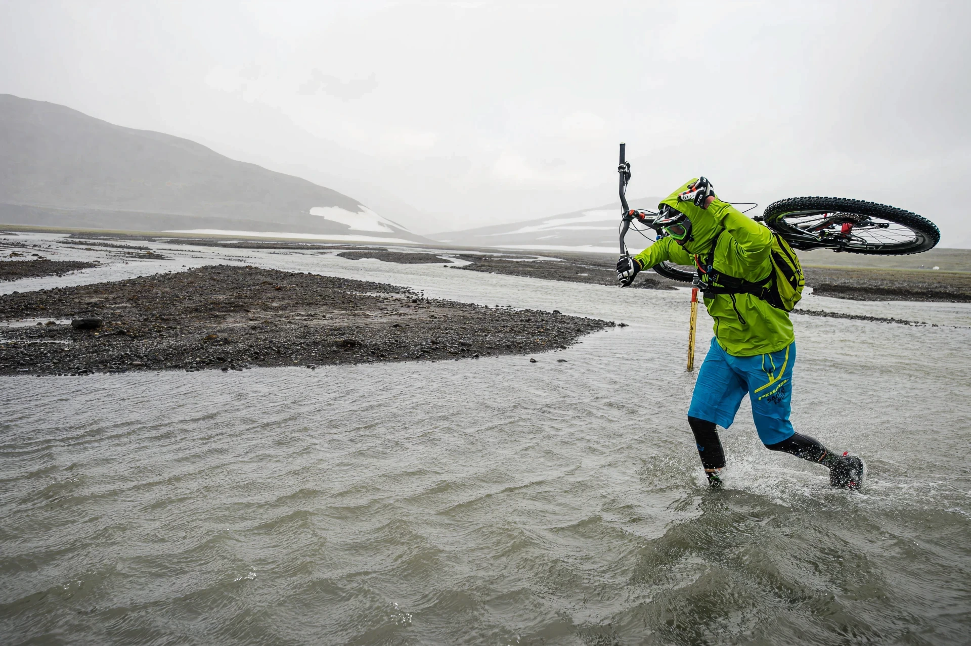 Biker crossing Iceland's river