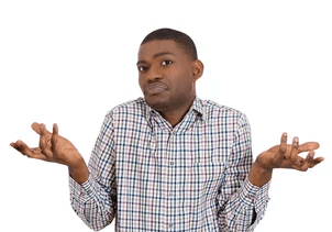 A person holding hands with a hand on their chest.
