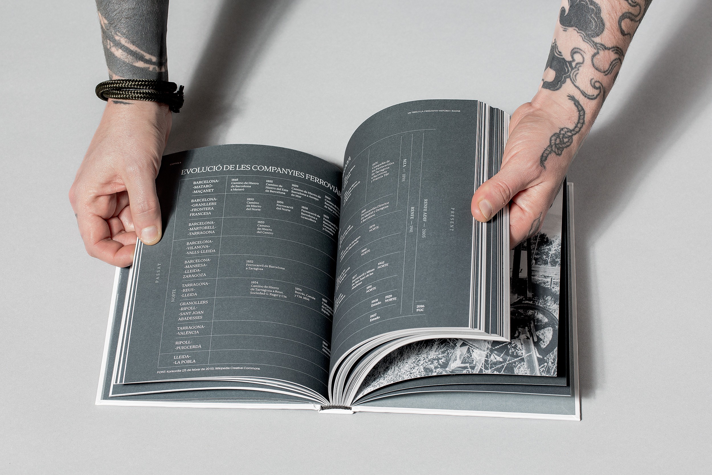 Open book with sunlight and shadows highlighting editorial typography design