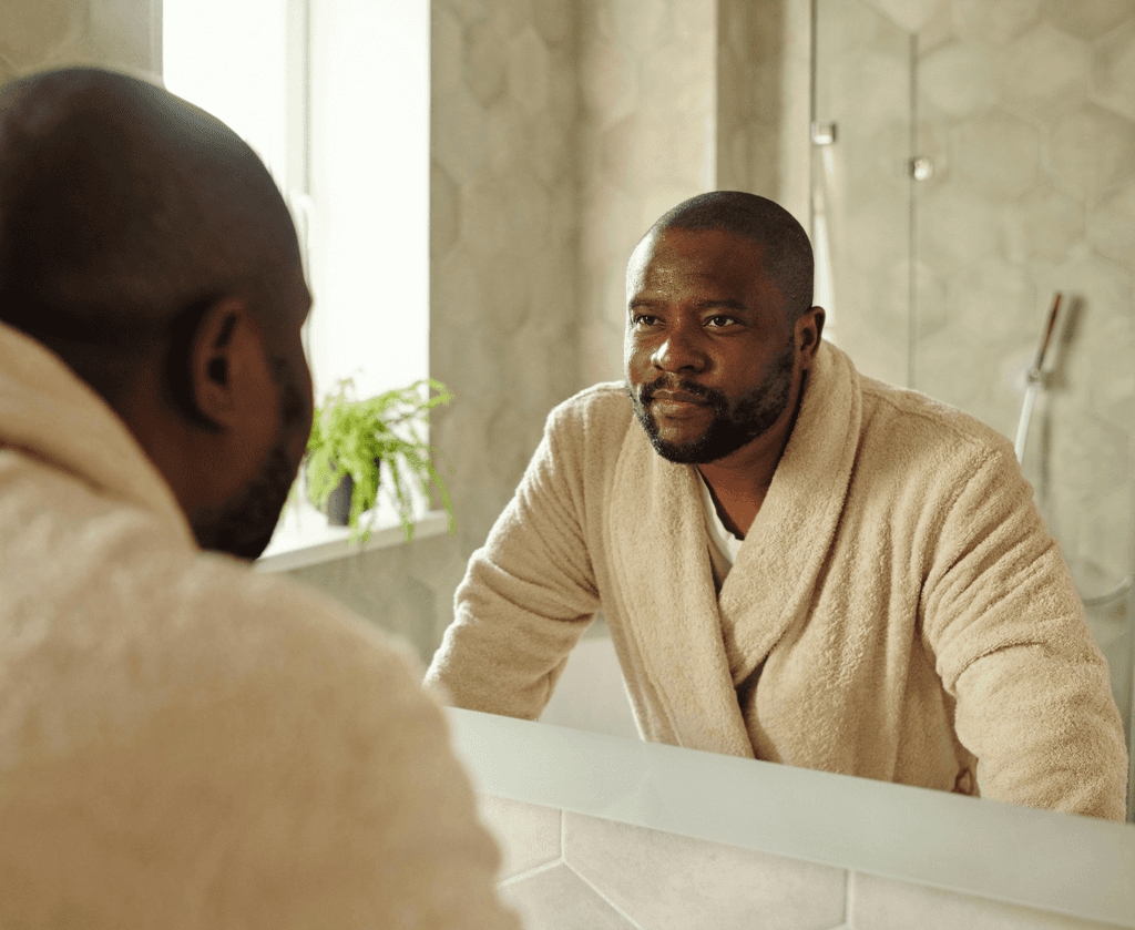 man looking in mirror