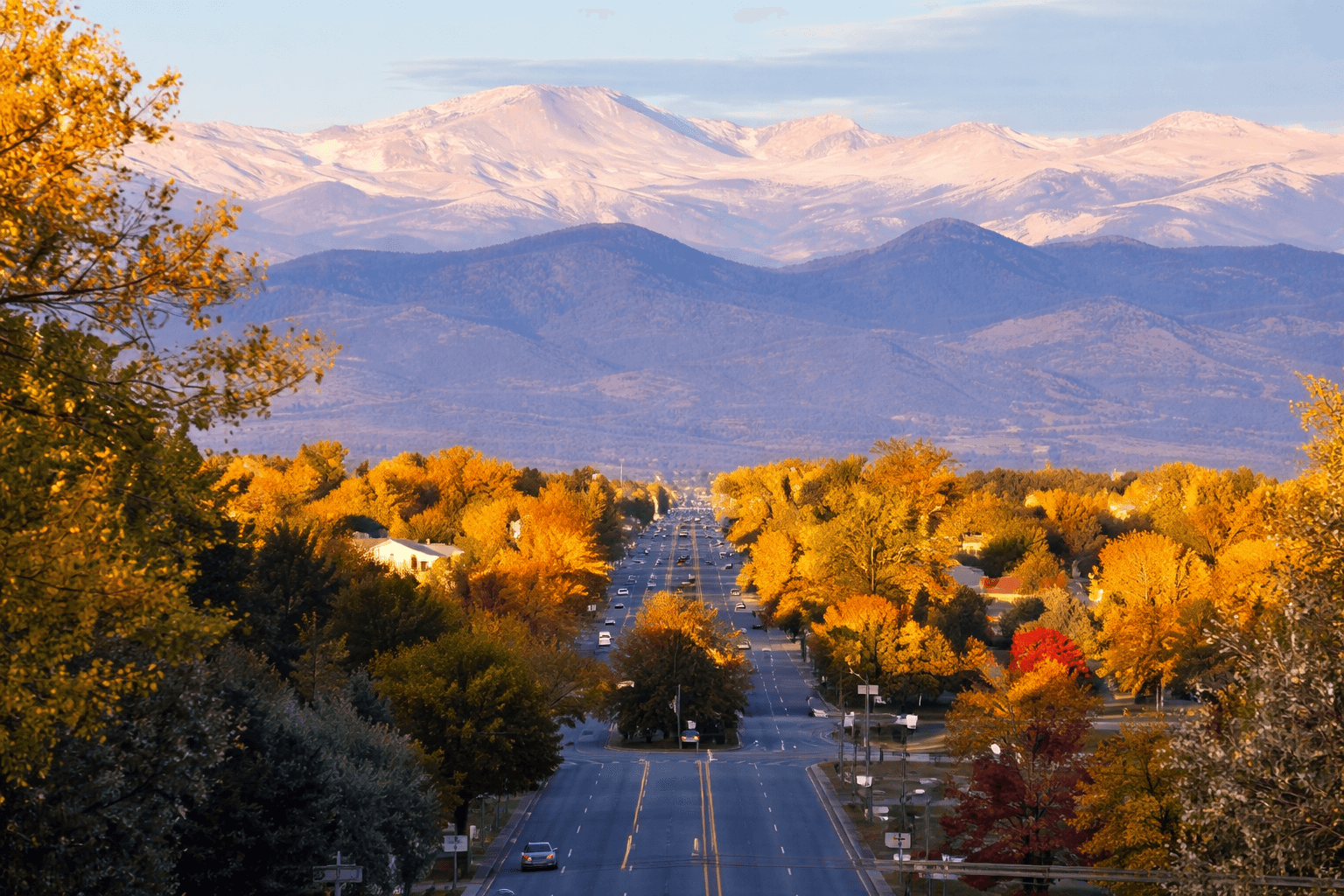 Scenic pond and office buildings surrounded by fall foliage in Centennial, Colorado — Bergan & Co property management service area