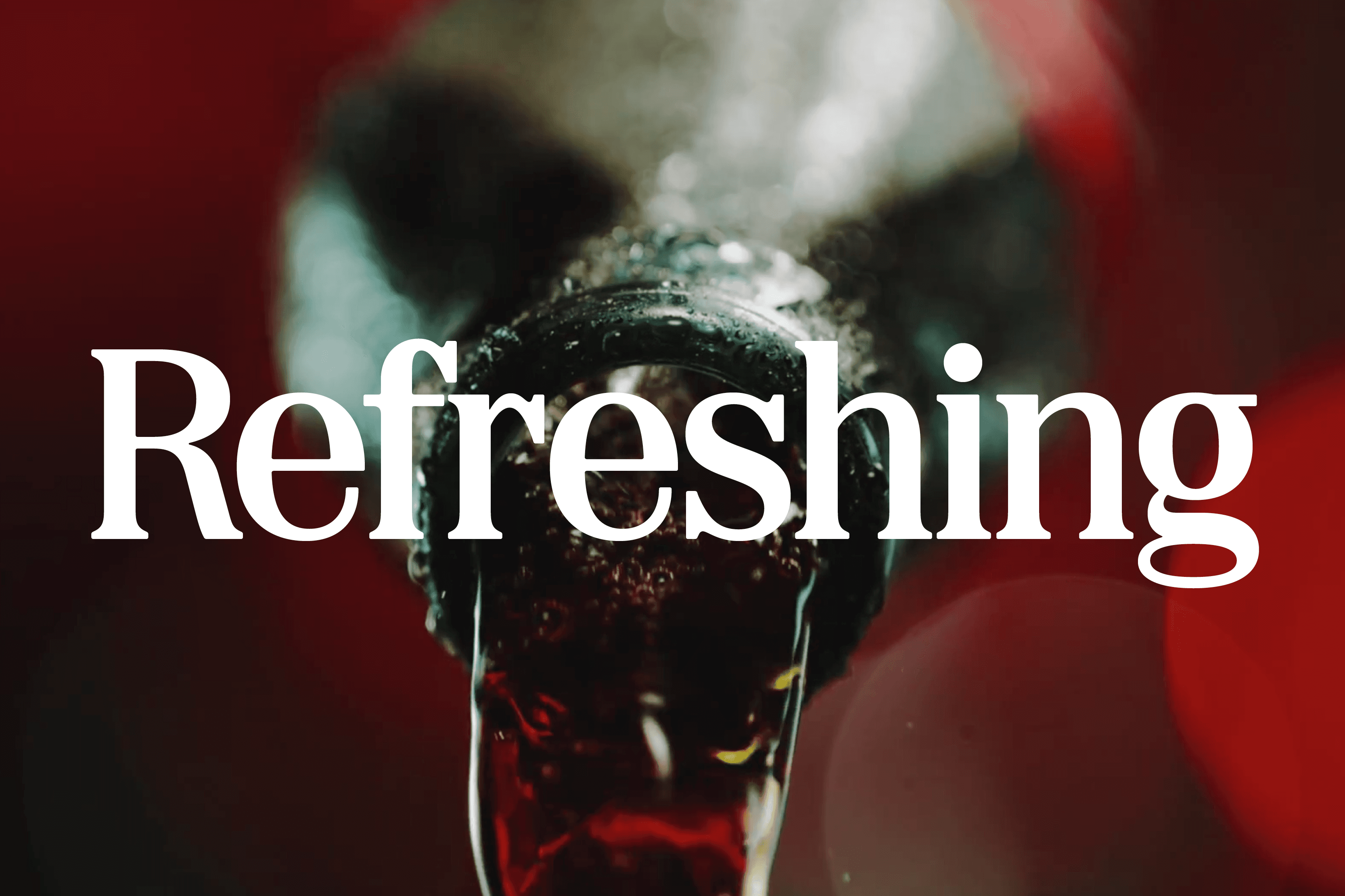 A close-up of a beverage with the word "Refreshing" in bold white text against a blurred red background.