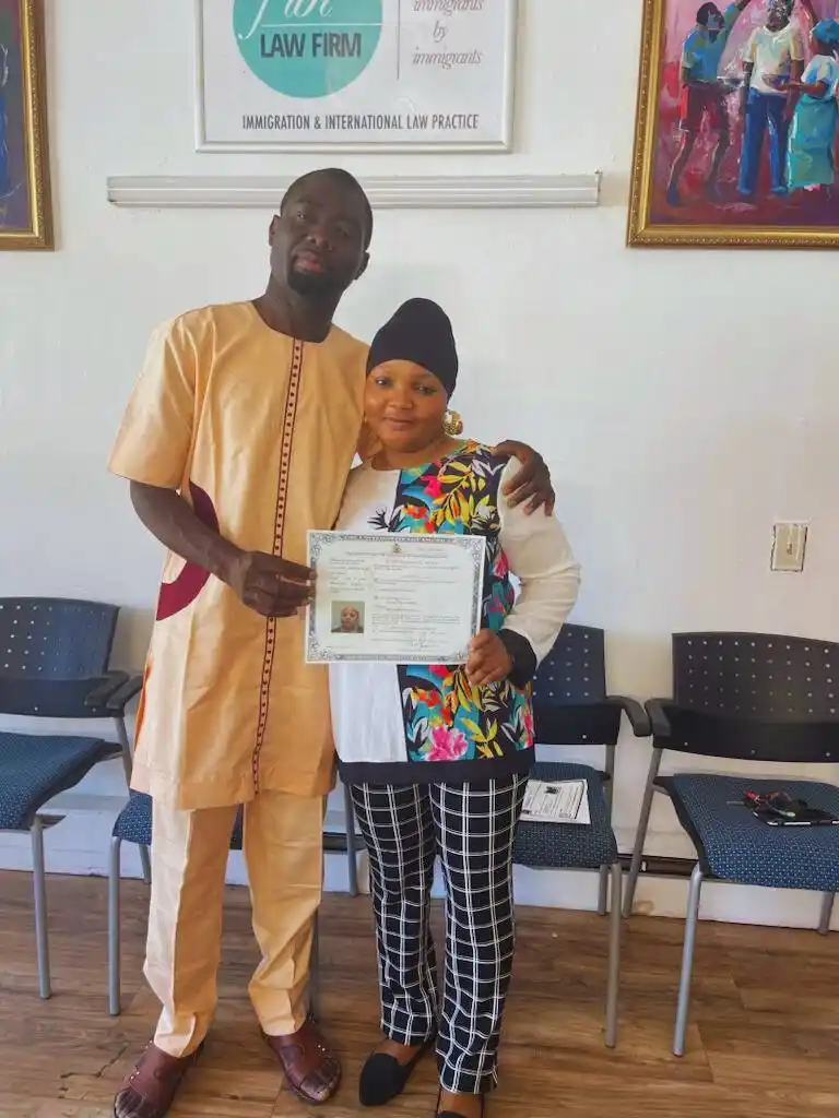 Happy family celebrating U.S. citizenship, thanks to Fibi Law