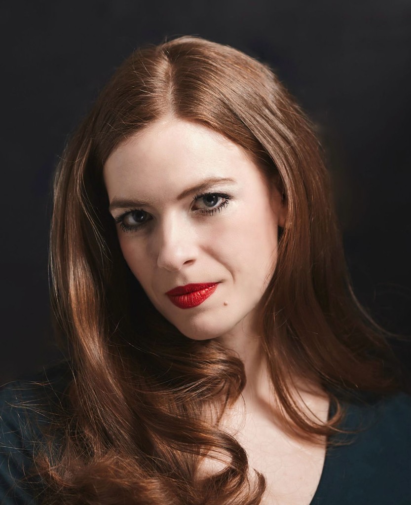 female photographer with red hair