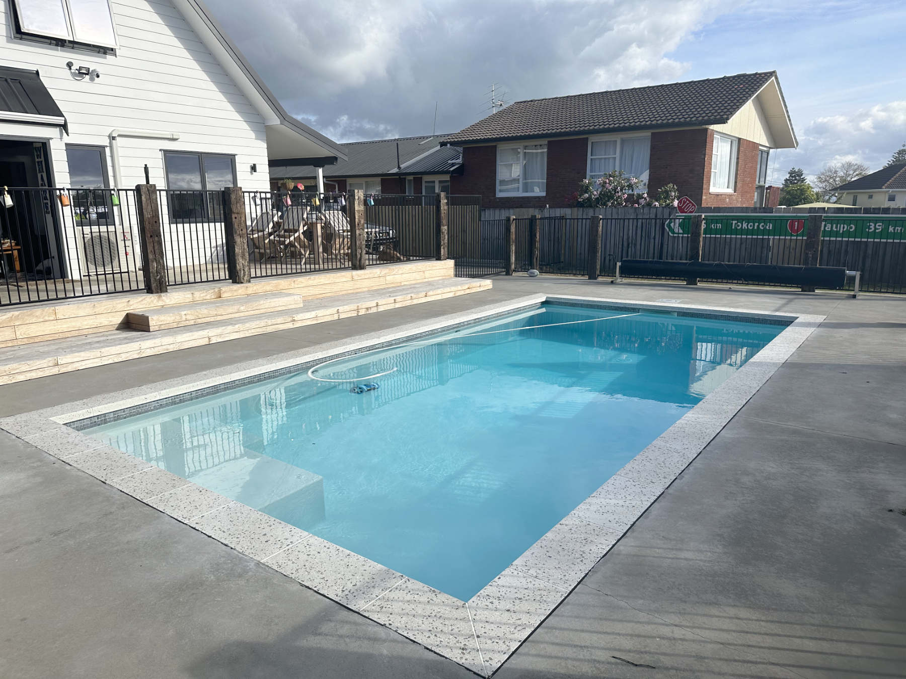 Hardscape outdoor area, with a pool, fencing and deck, Maraetai, East Auckland builder