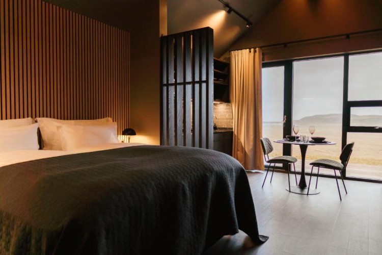 sunloungers fronting buildings near mountain