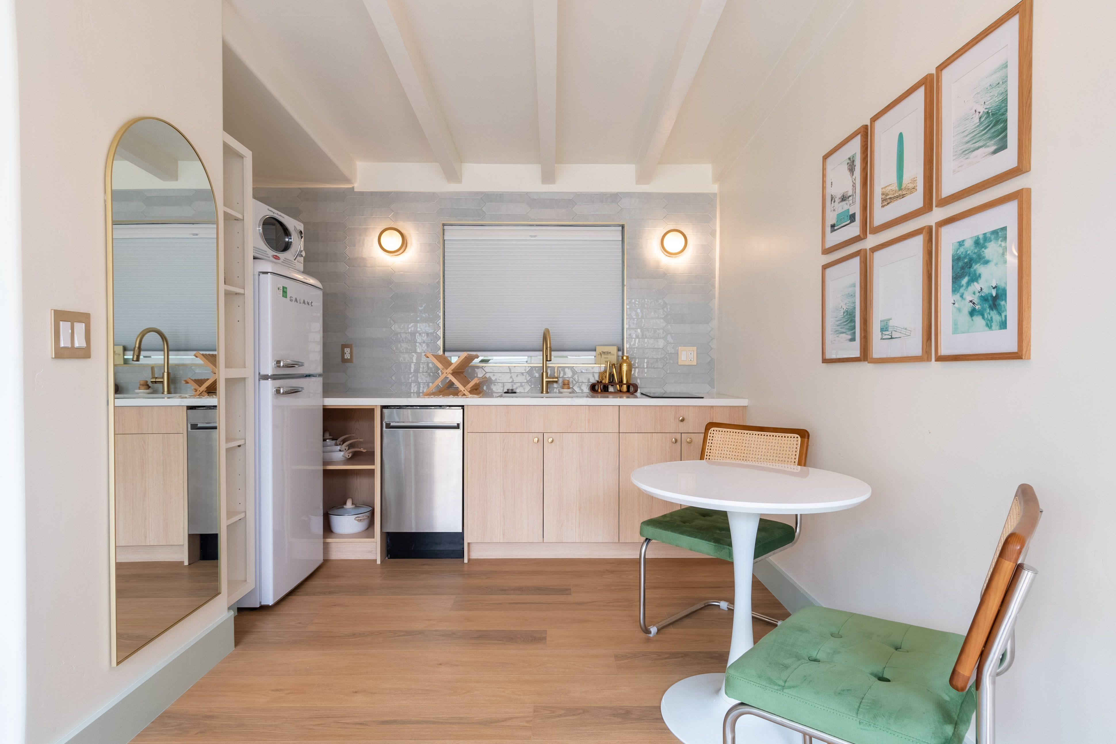 boats on seashore near houses