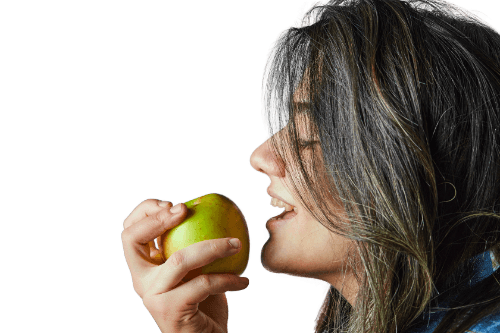 Woman with white hair smiling broadly, on a transparent background, used for the full mouth restoration section