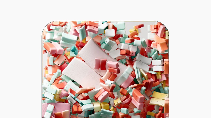 A box full of colorful foams being blowned by force