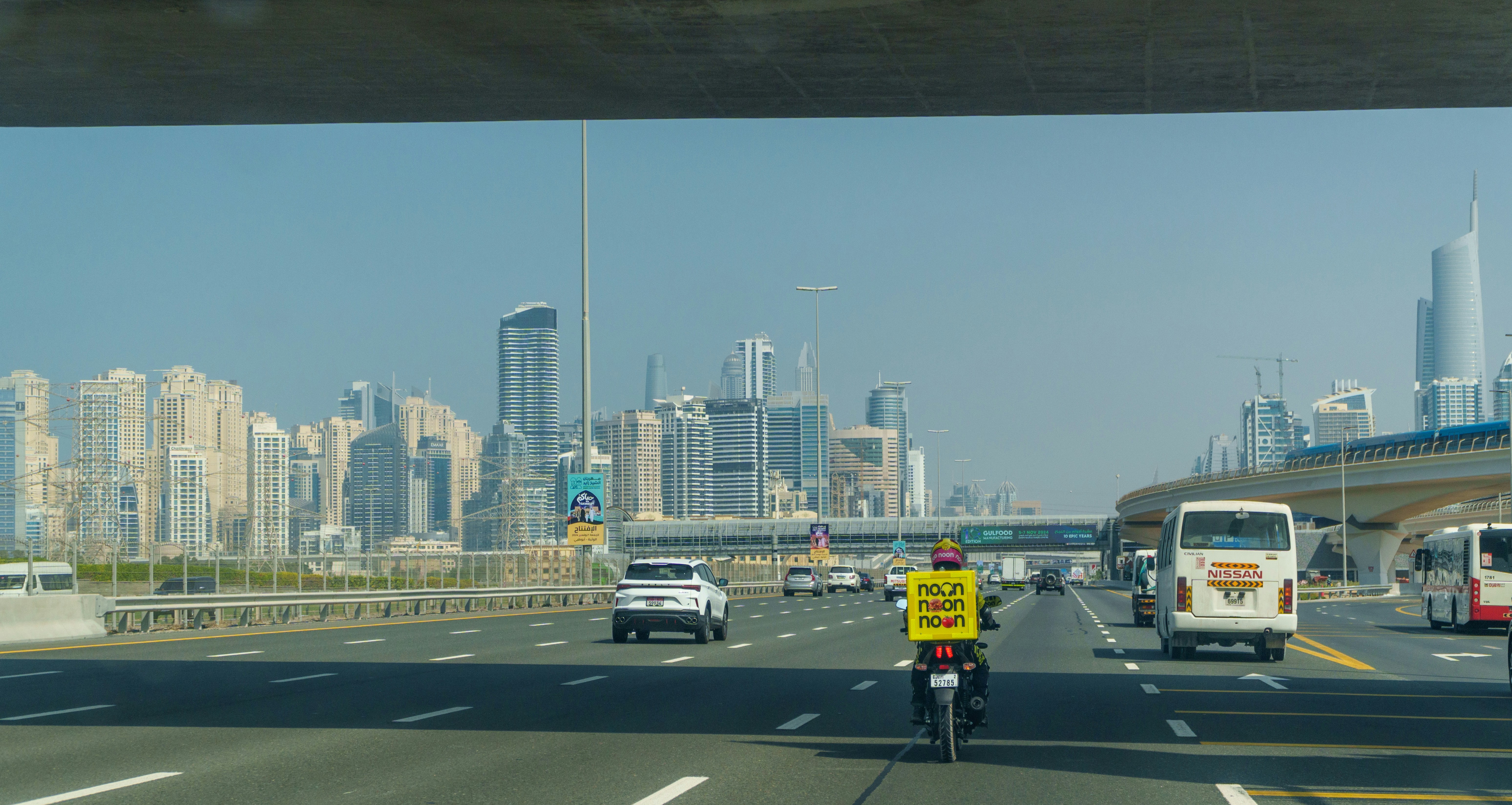 Road with cars and buildings in the background