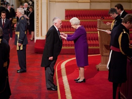 Paul C Doherty receiving his OBE from the Queen