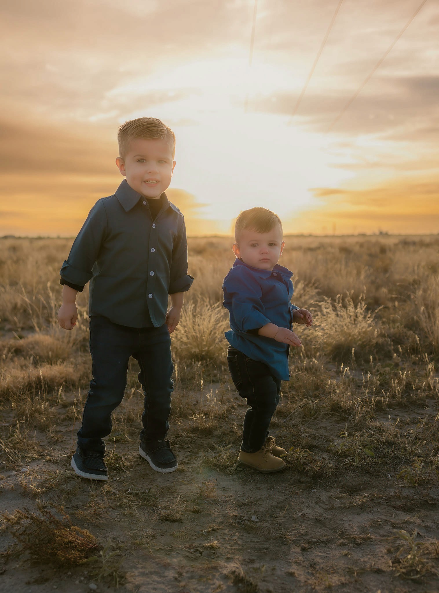 A couple stands closely in an intimate embrace.