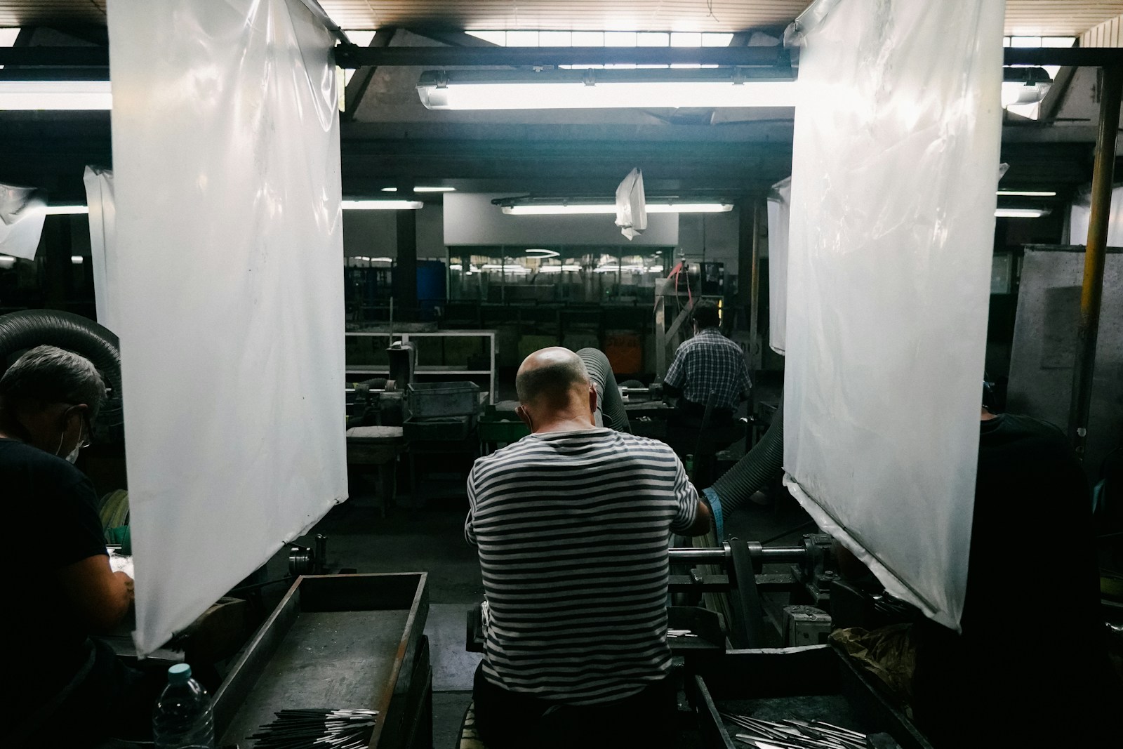 Men working in an industrial space