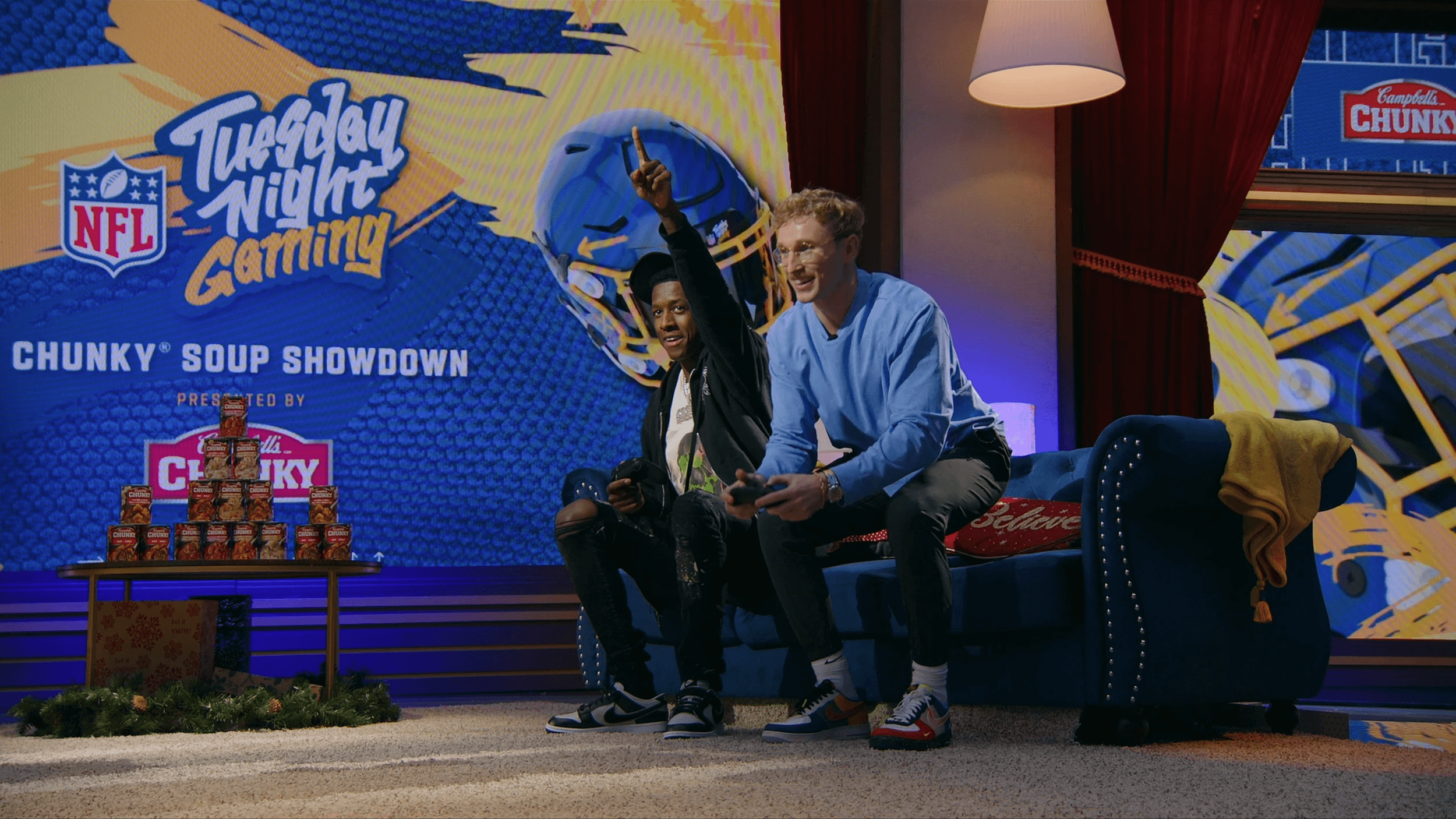 Two players game on a sofa on the Tuesday Night Gaming Chunky Soup Showdown set
