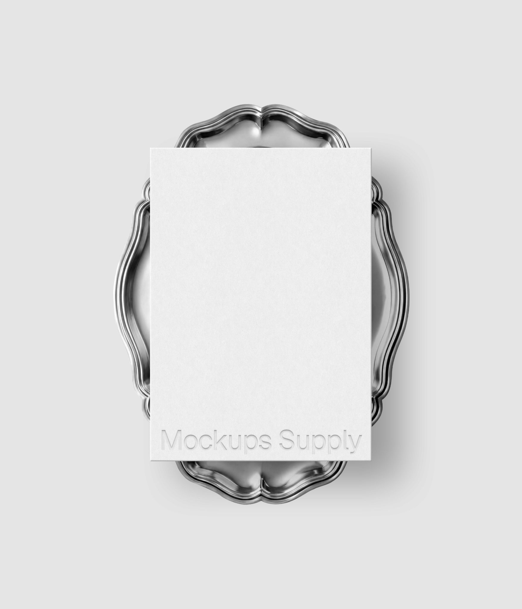 Wedding invitation card mockup with embossed typography on ornate silver plate for wedding stationery and luxury design showcase