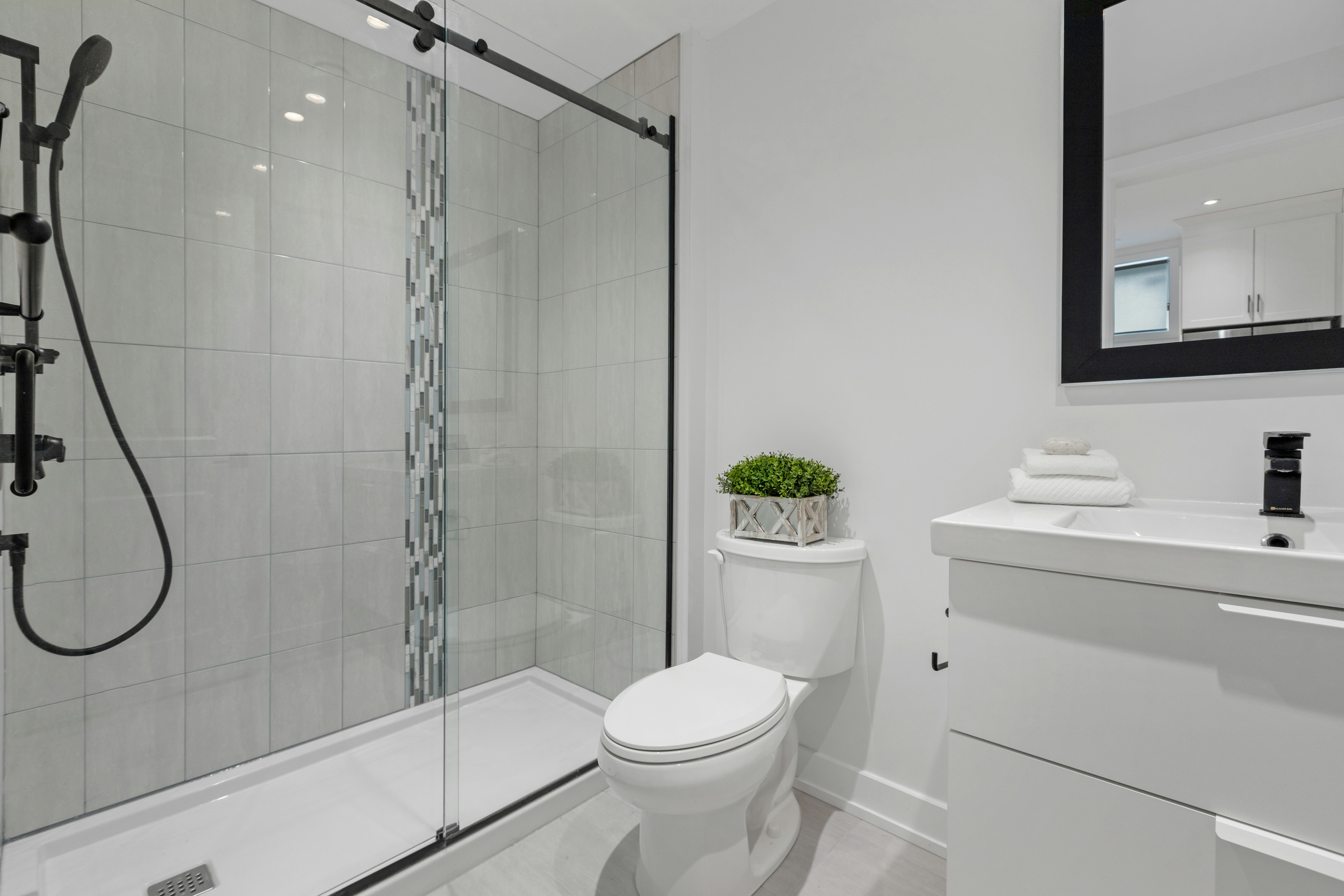 a bathroom with a glass shower