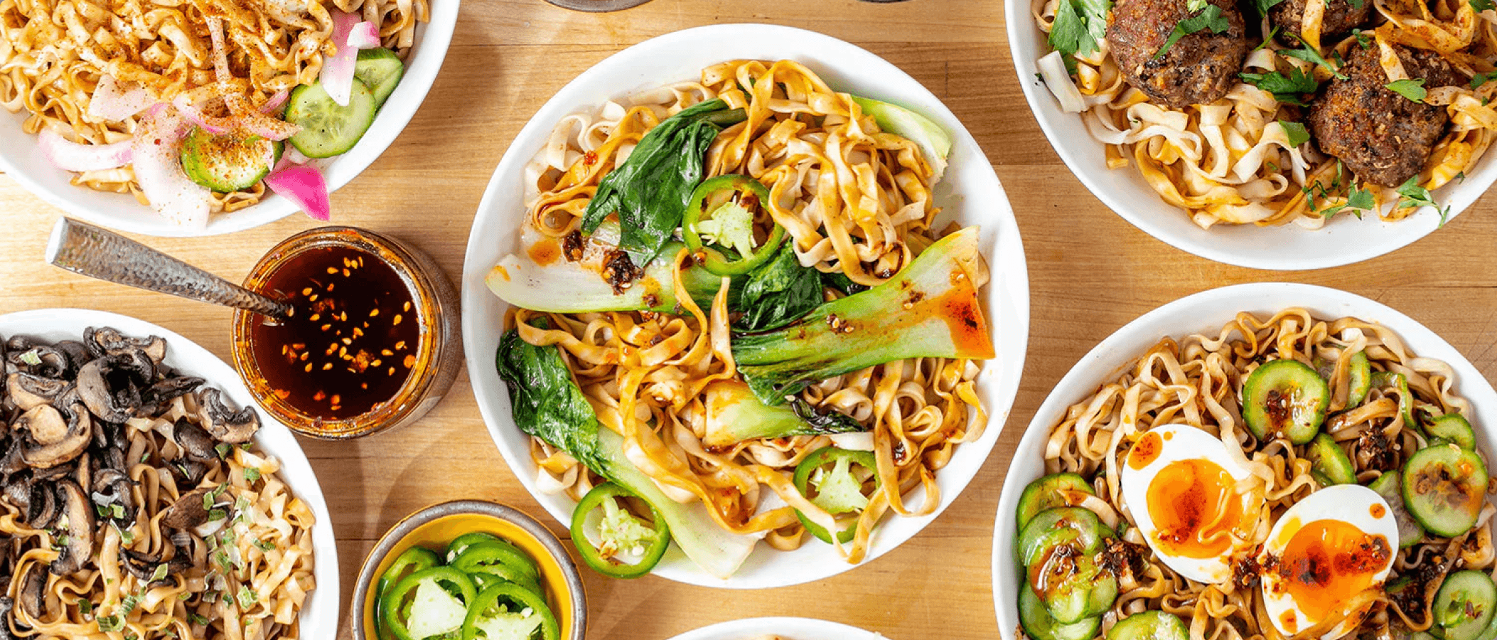 Momofuku noodle and chili crisp dishes lifestyle hero image