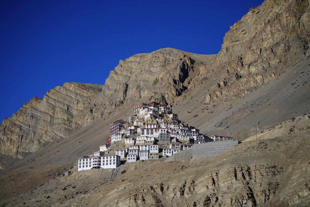 a view of a city and mountains from a distance