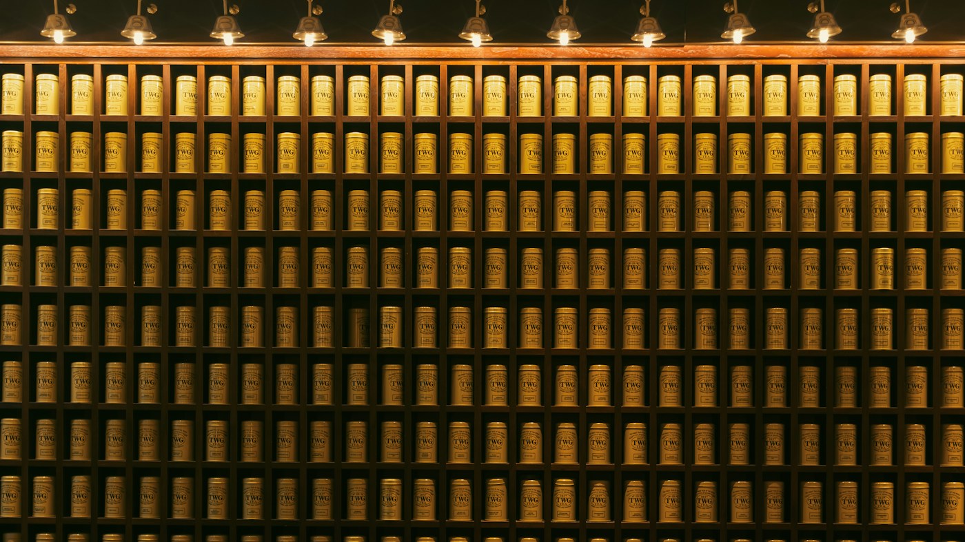 Wall of gold bars illuminated by spotlights