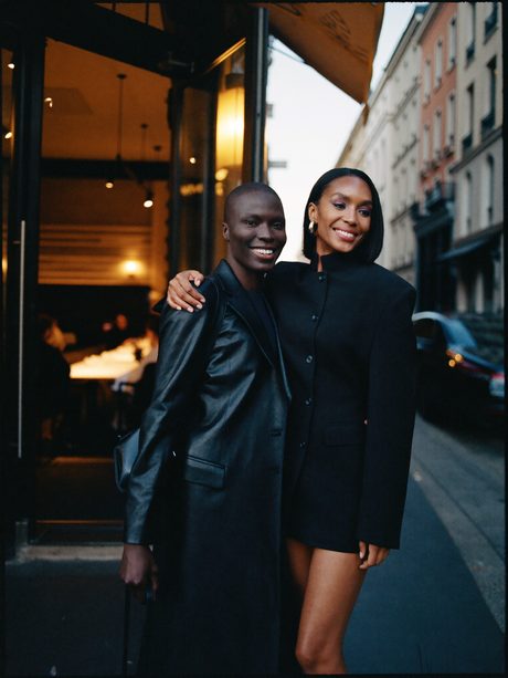 A couple outside a restaurant at dusk