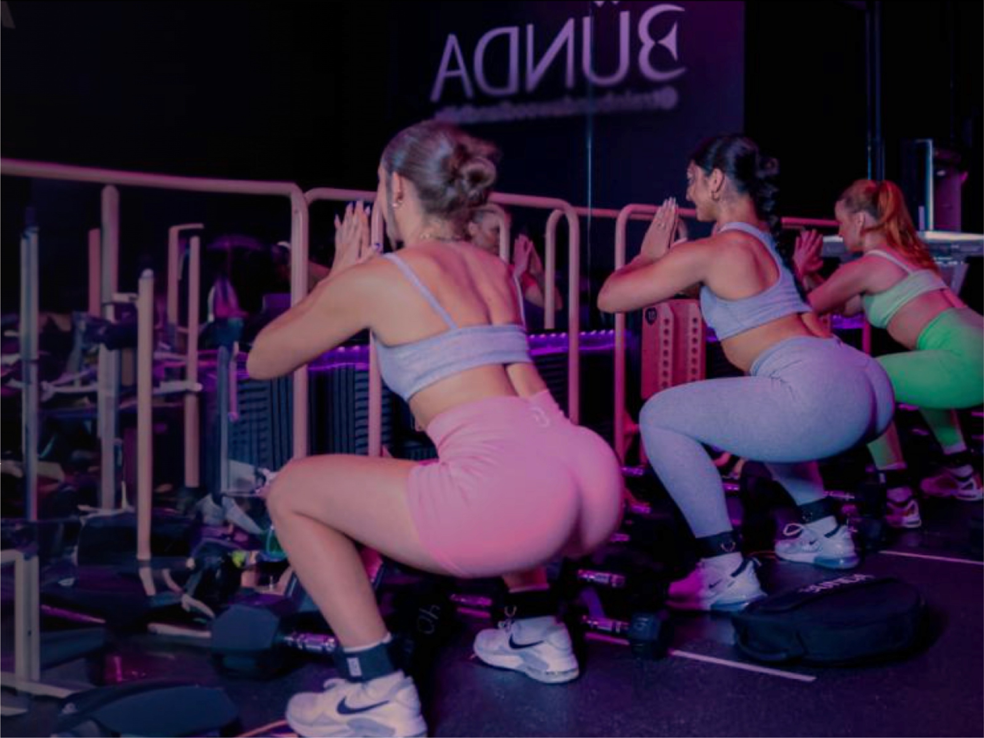 women doing squates in a train bunda facility