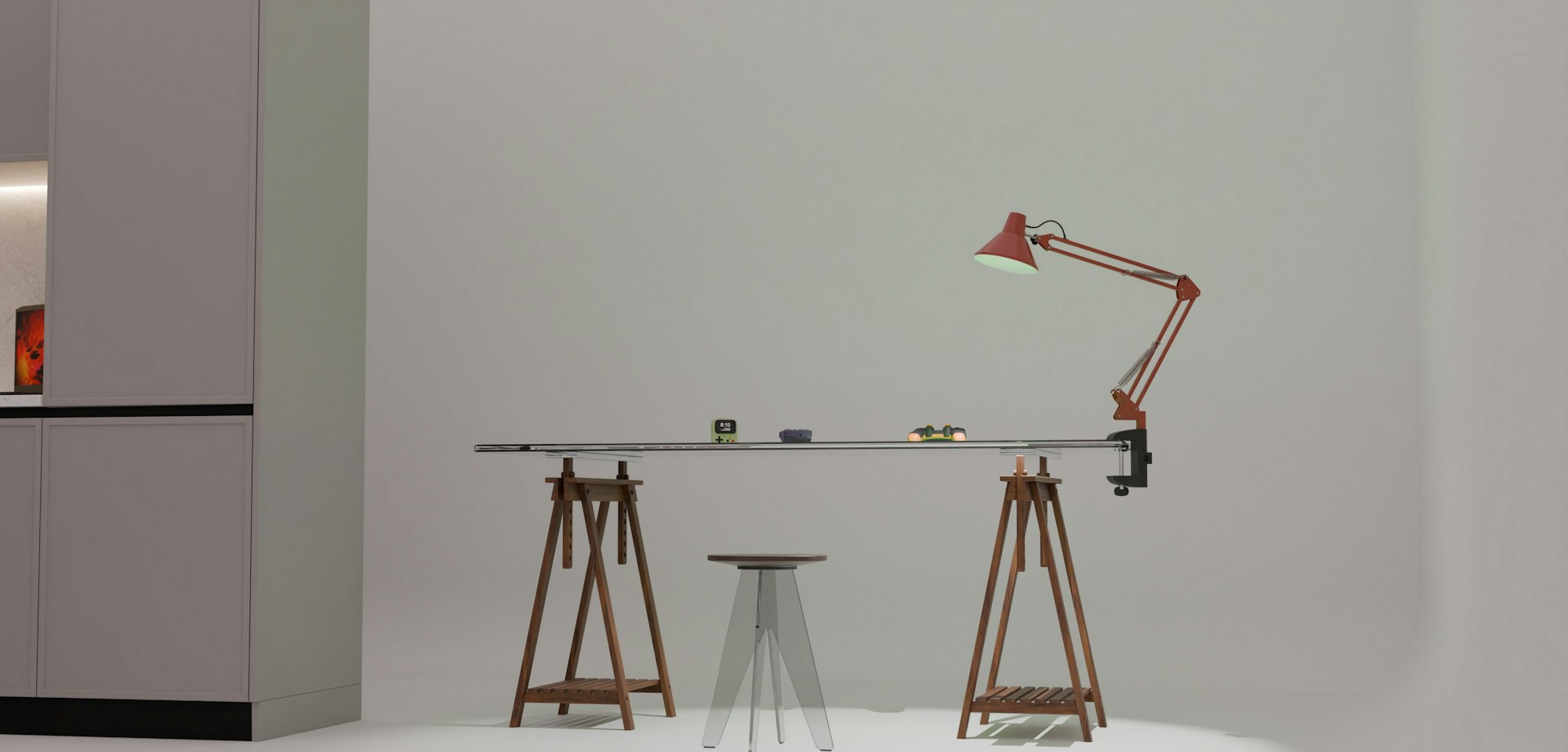A long table and a red lamp in a quiet studio