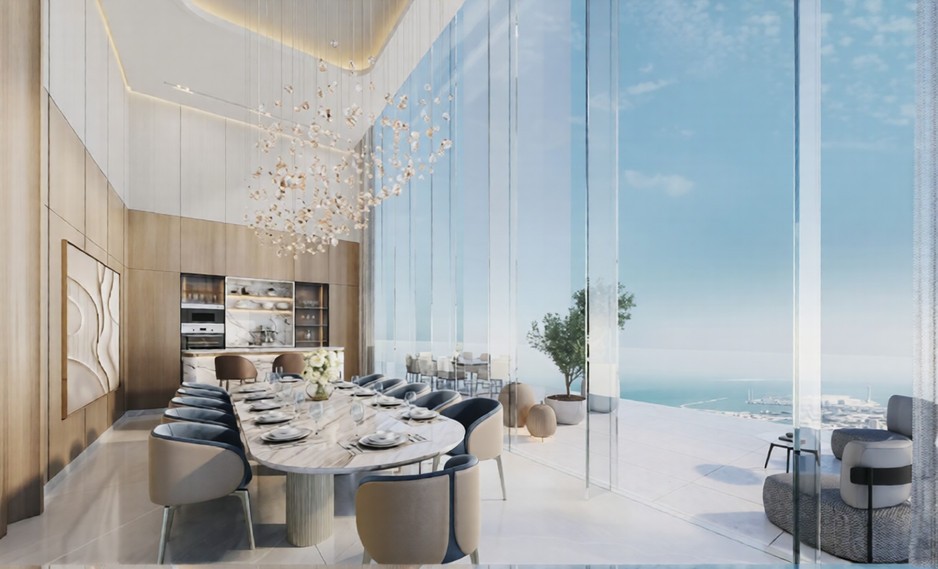 Penthouse dining room in the Hilton Residences featuring double-height windows, a long marble table, and a statement chandelier.