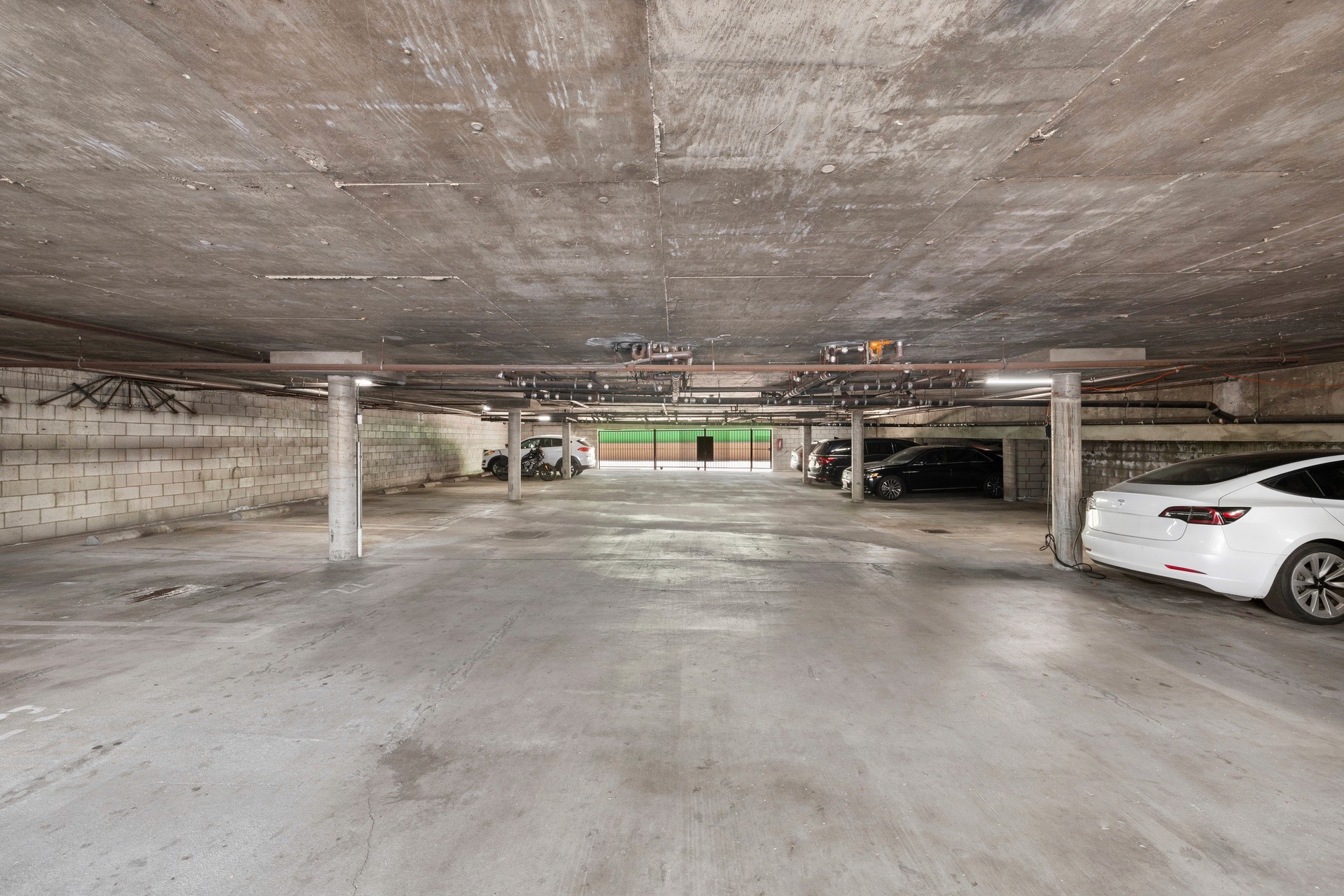 Interior parking garage with assigned spaces at 18620 burbank blvd.