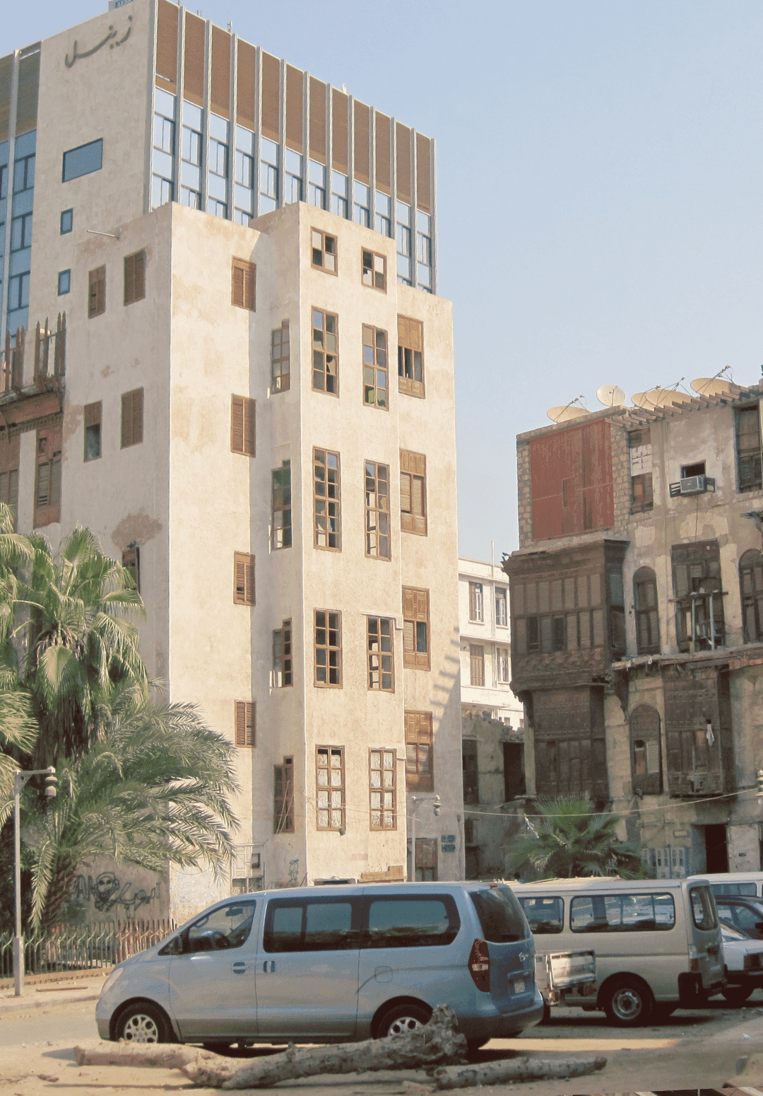 Sunlight illuminates a section of a building's facade.