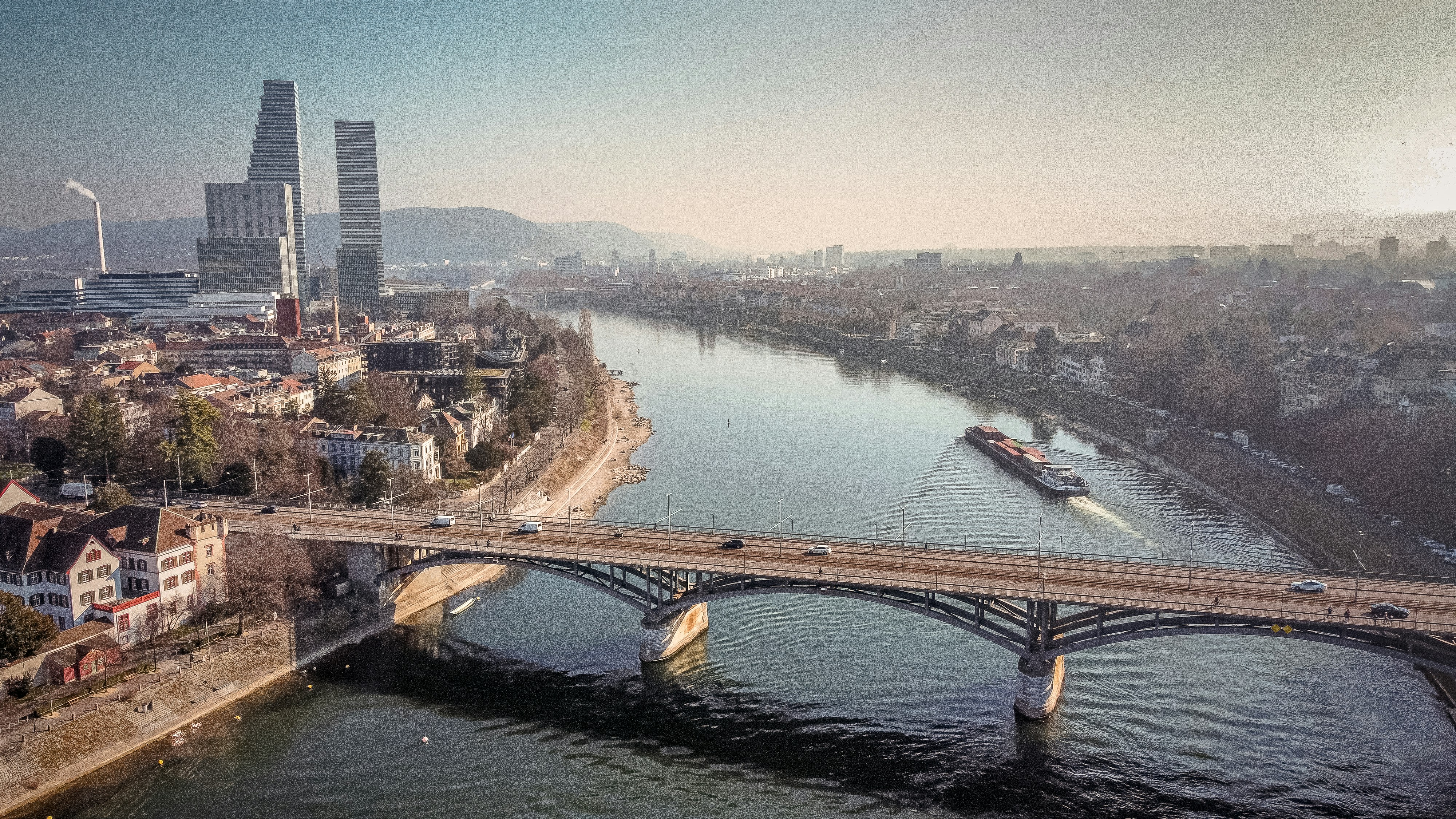 a bridge over a river with a boat on it