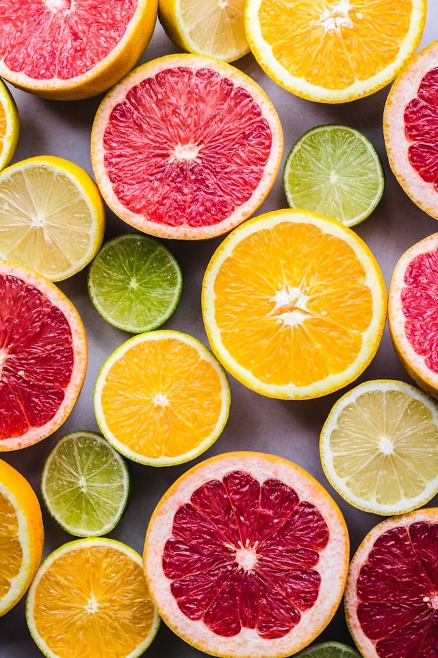 Brighly colored and organized citrus fruits